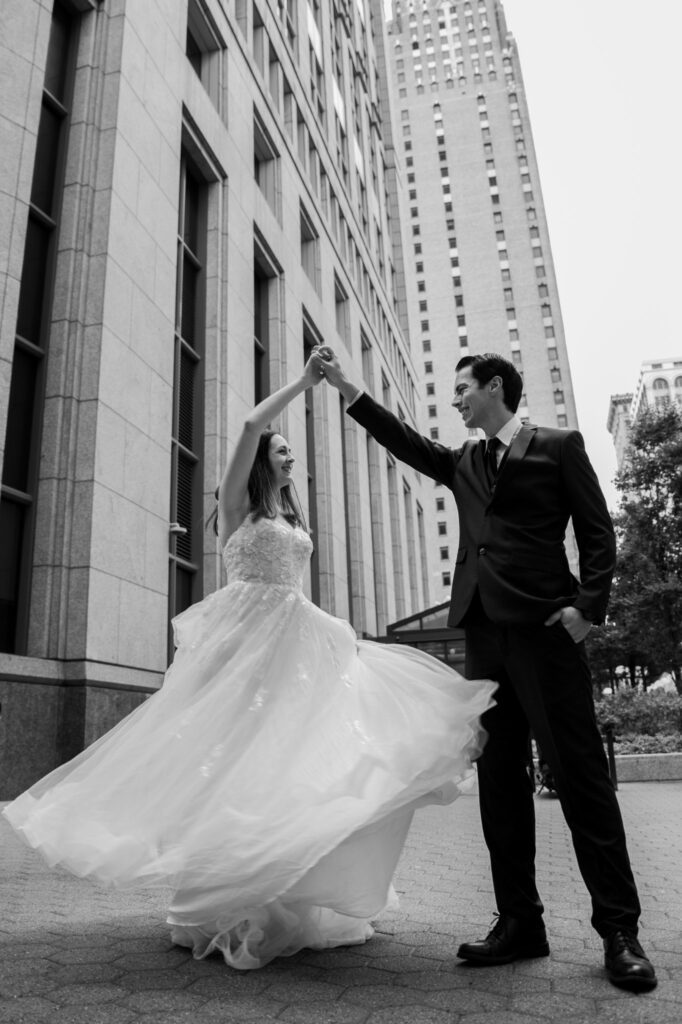 Bride twirling with the groom, at Shinola Hotel