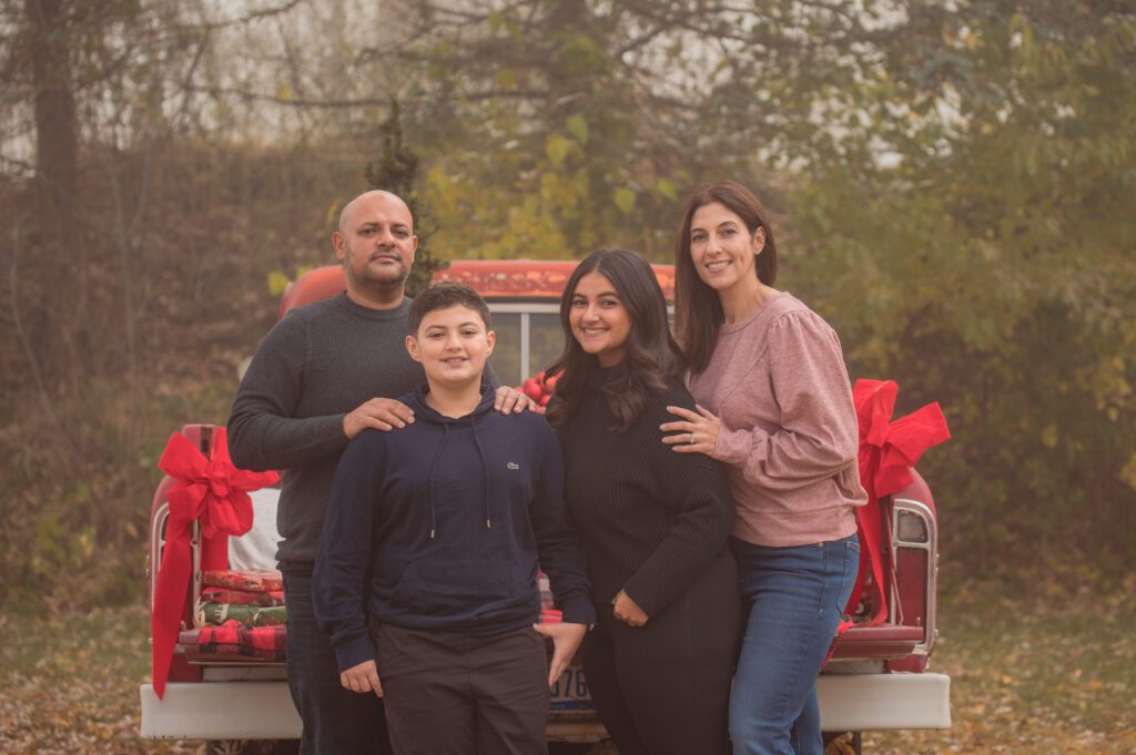 Holiday Family Photos in a Red Truck Mini Sessions at White Lake, MI. 